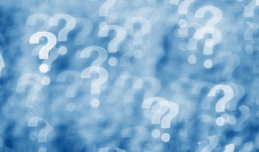 A blue and white collage of blurry question marks.