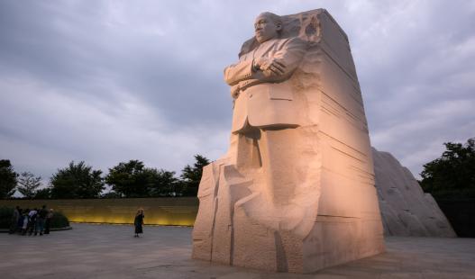 The Martin Luther King, Jr. memorial in Washington, D.C. on a cloudy day at dusk.
