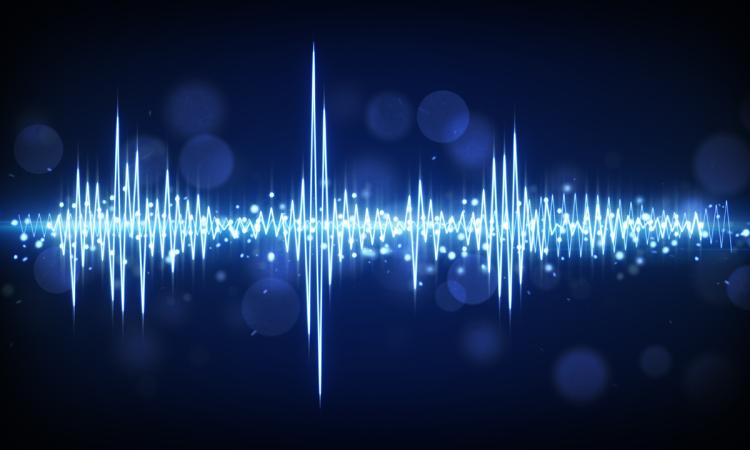 A blue audio waveform set against a dark background.