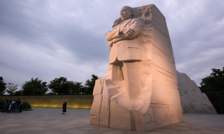 The Martin Luther King, Jr. memorial in Washington, D.C. on a cloudy day at dusk.