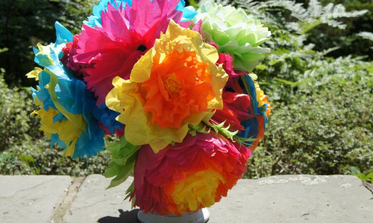 A bouquet of brightly colored tissue paper flowers